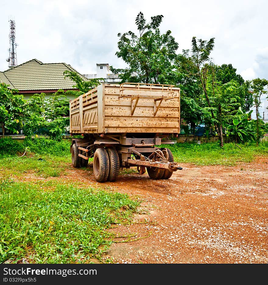 The Semi trailer on pebble road background