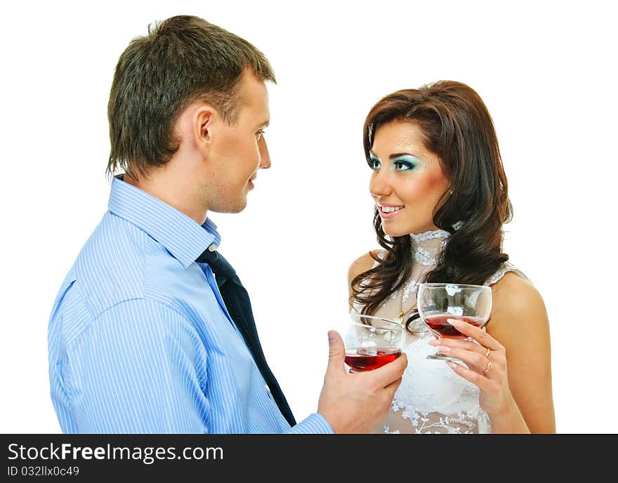 Happy young couple with wine glasses on white. Happy young couple with wine glasses on white