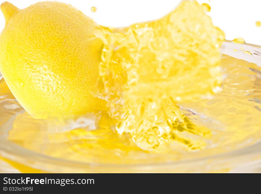 Lemon  falls into the juice. Lemon  falls into the juice