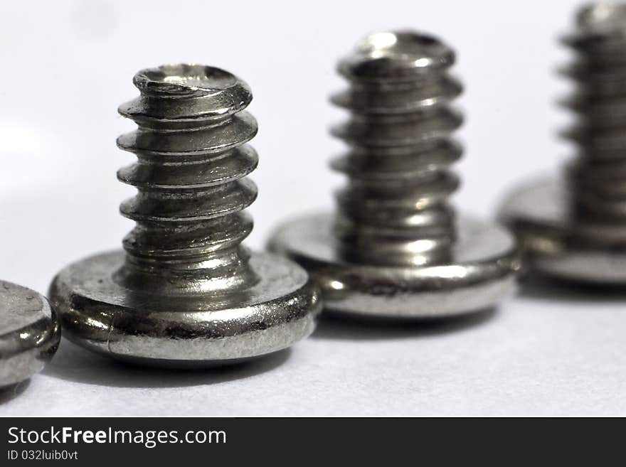 Macro of shiny screws for computer (shallow depth of field). Macro of shiny screws for computer (shallow depth of field)