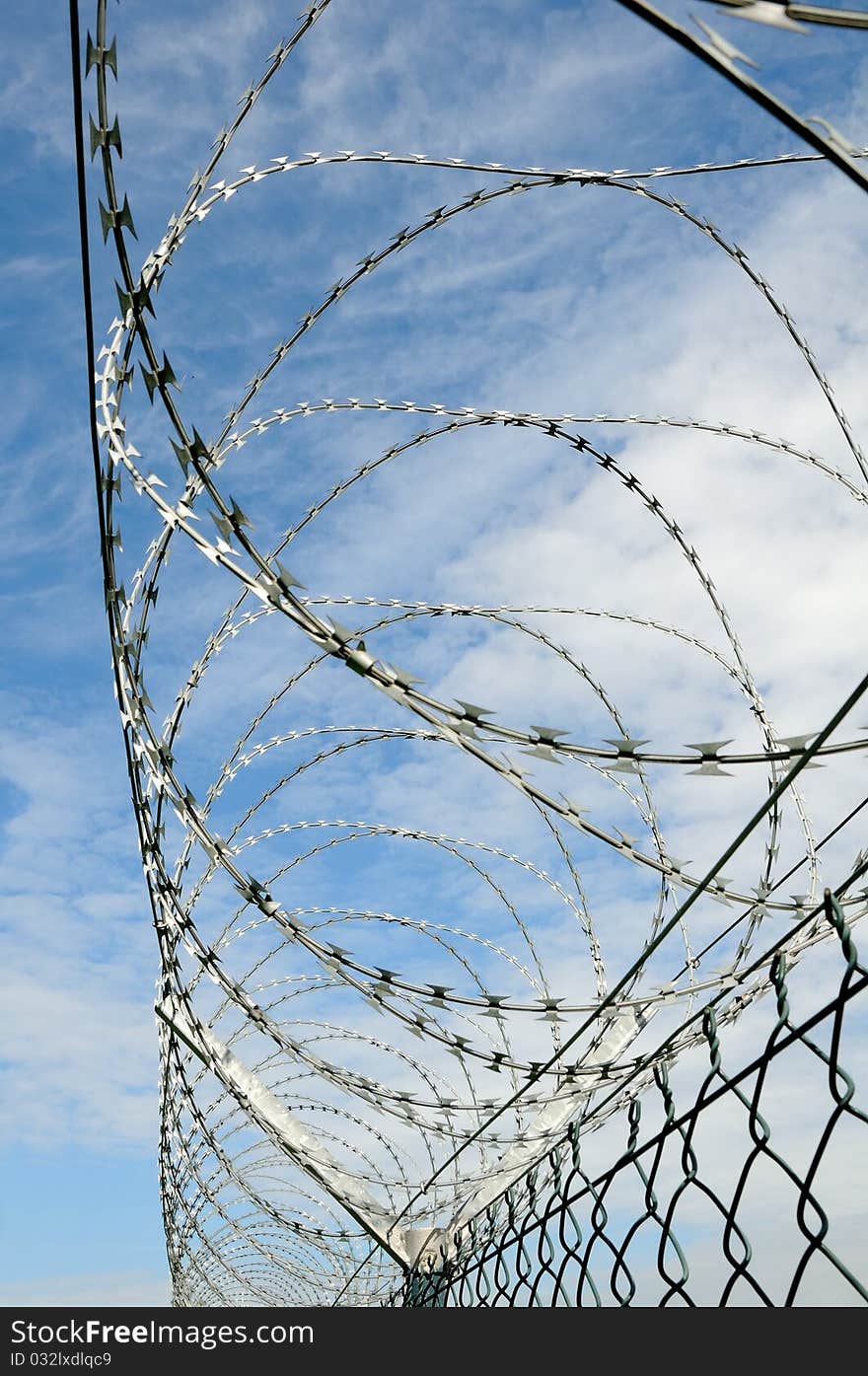 Barbed wire against a blue sky