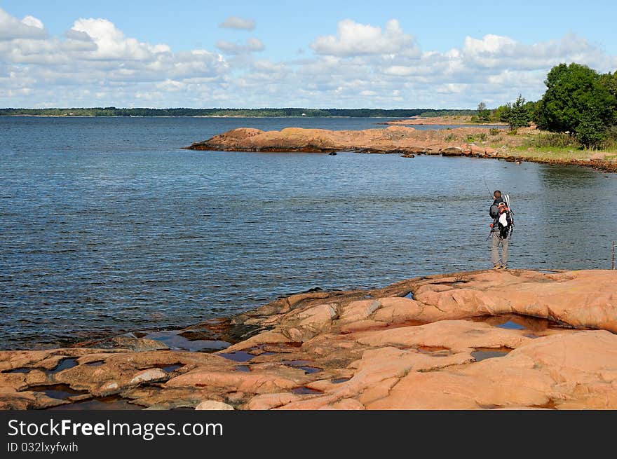 A fisherman angling on the sea