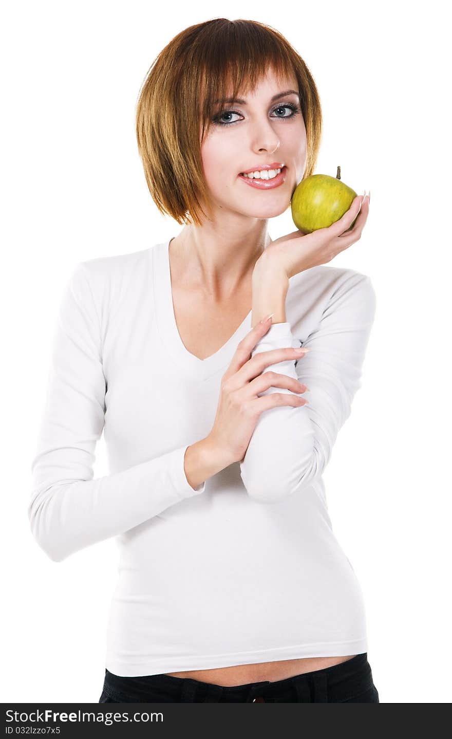 Portrait of a young beautiful woman with a green apple against white background