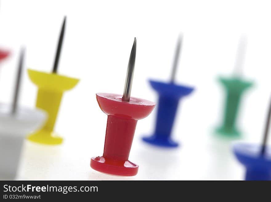 Multicolored pushpins isolated on a white