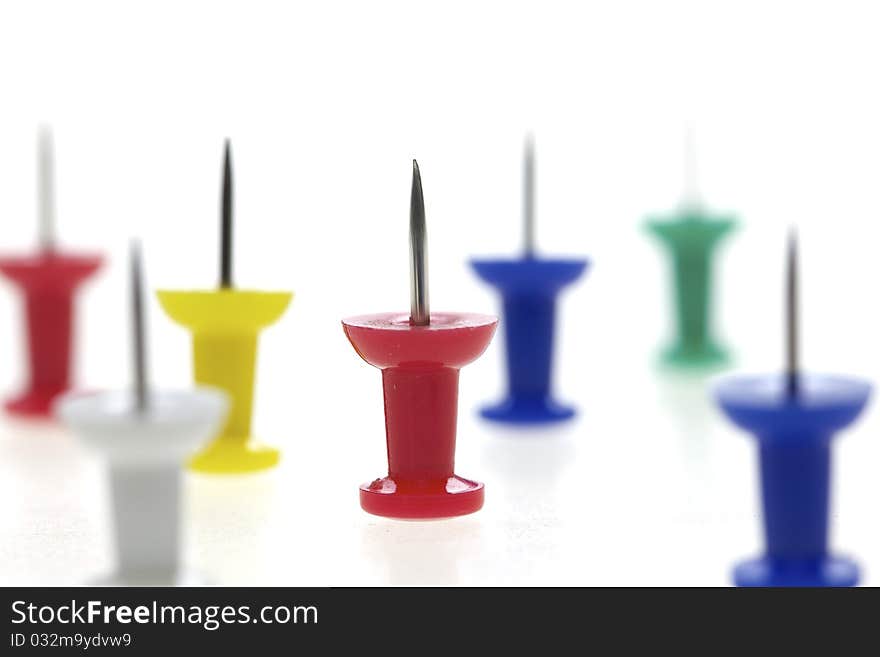 Multicolored pushpins isolated on a white