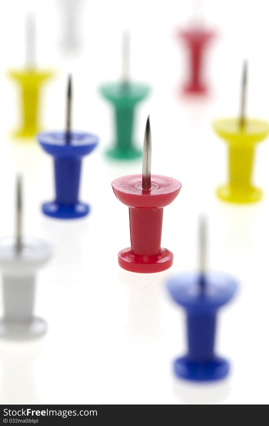 Multicolored pushpins isolated on a white