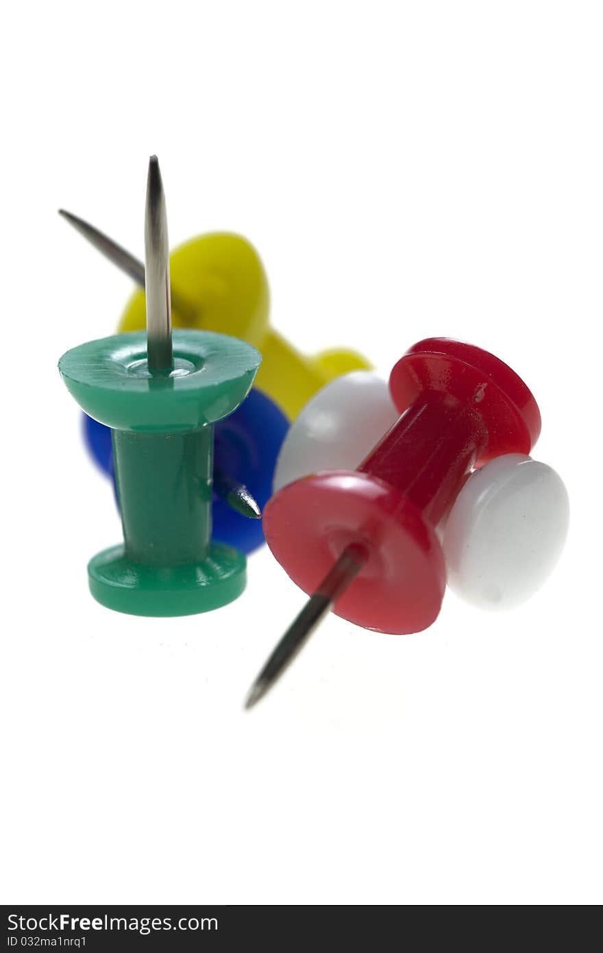 Multicolored pushpins isolated on a white