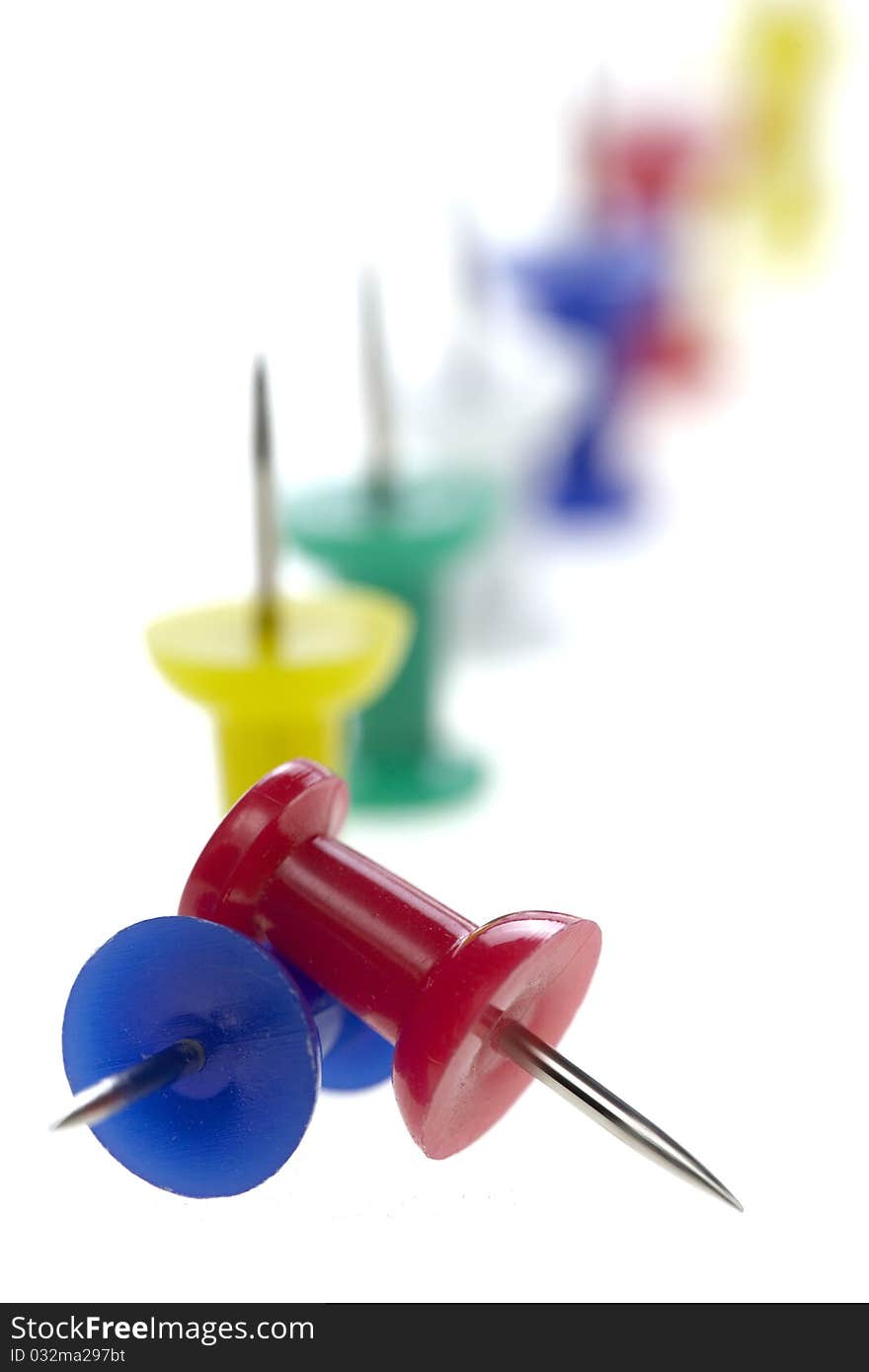 Multicolored pushpins isolated on a white