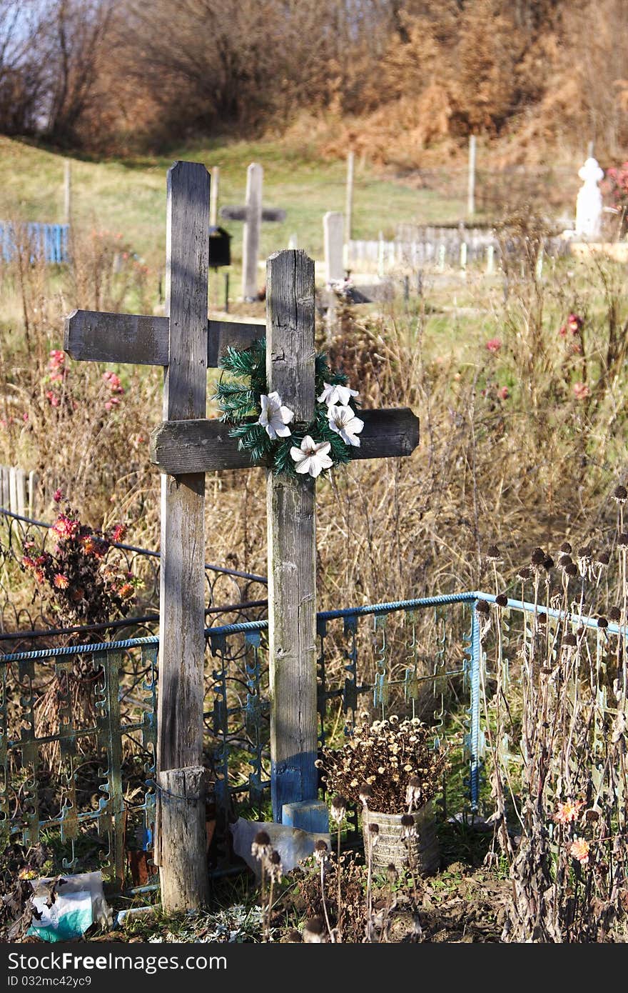 Wood crosses in a typical orthodox graveyard located in the Carpathians hills, Transylvania