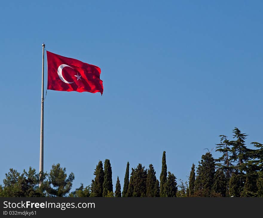 The Turkish flag flutters in the wind.