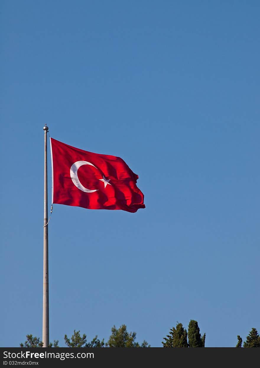 The Turkish flag flutters in the wind.