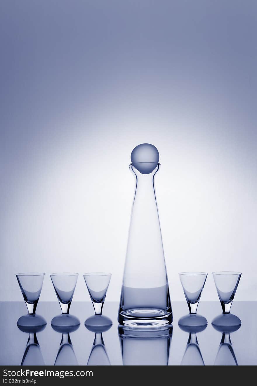 Decanter And Five Glasses Backlit And Blue-toned