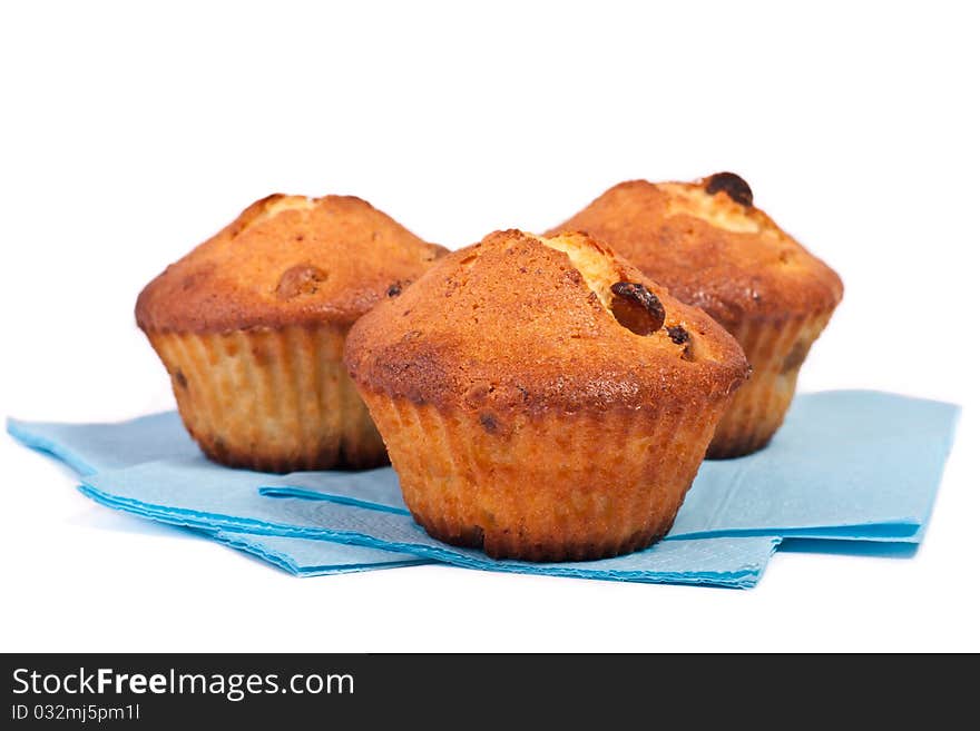 Tree muffins on blue napkin