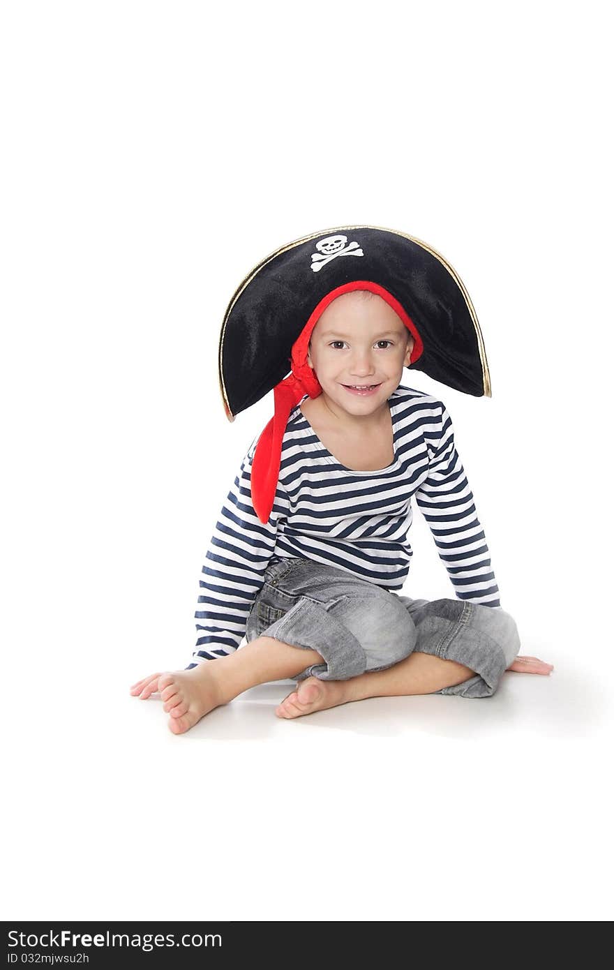 Boy dressed as pirate over white