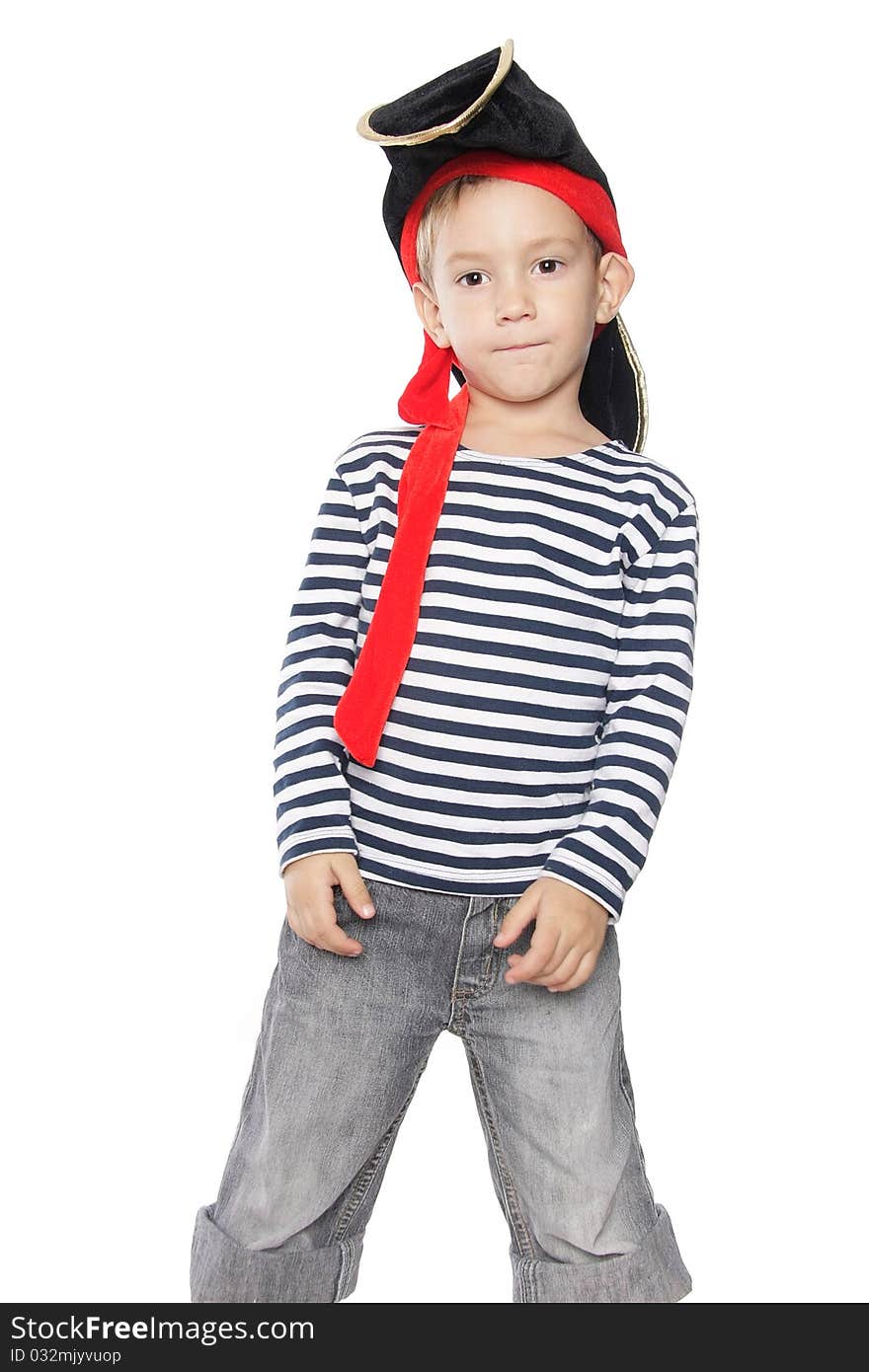 Young boy dressed as pirate over white