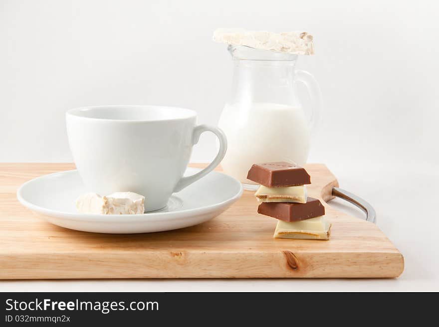 Breakfast with milk and chocolate on a white background