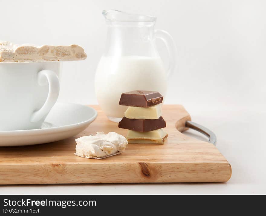 Breakfast with milk and chocolate on a white background