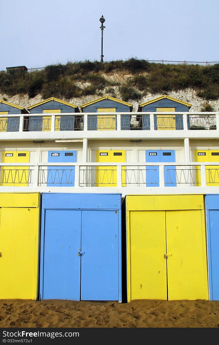 Cheery seaside beach huts on seafront at Broadstairs. Cheery seaside beach huts on seafront at Broadstairs