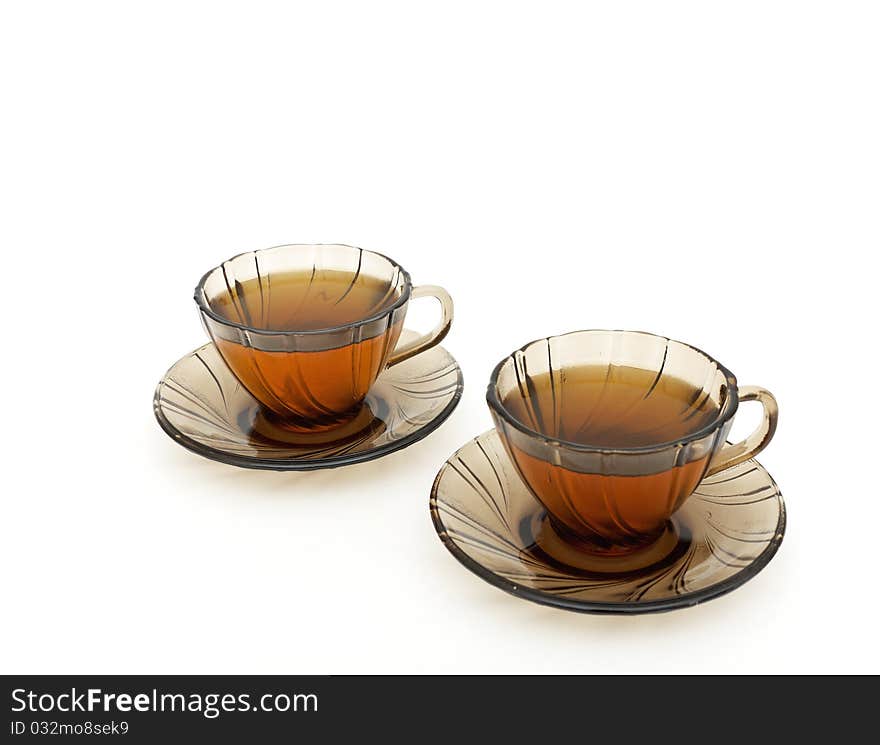 Tea for two with sweets isolated on white background