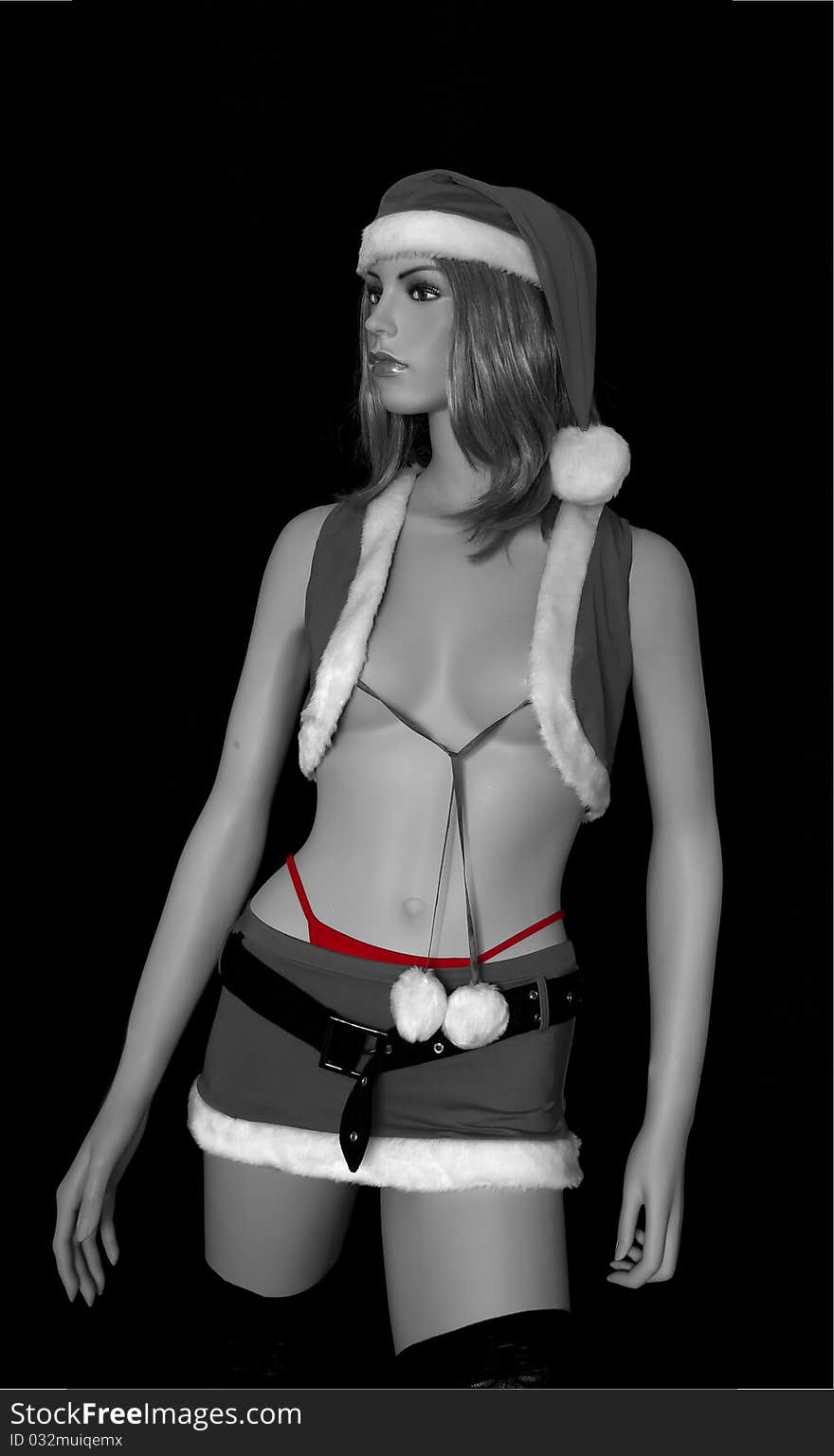 Image in black and white with a touch of red of a woman dressed as Santa Claus