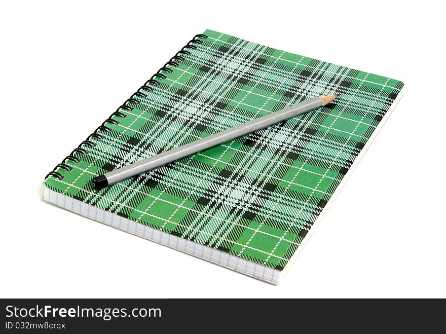 Notebook with pencil on white background