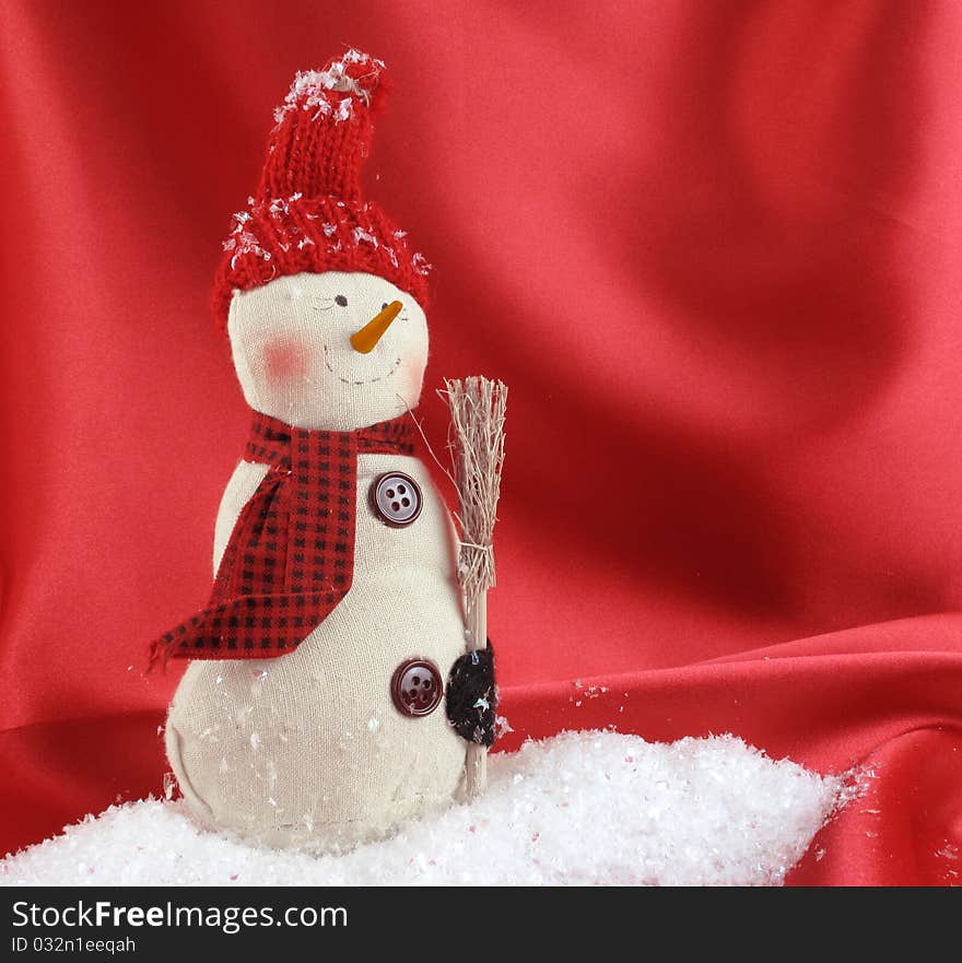 Snowman on red satin