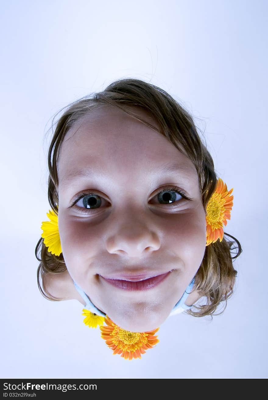 A little girl holding in her hand a beautiful flower. A little girl holding in her hand a beautiful flower