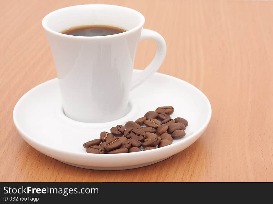 Coffee cup and grain on the table