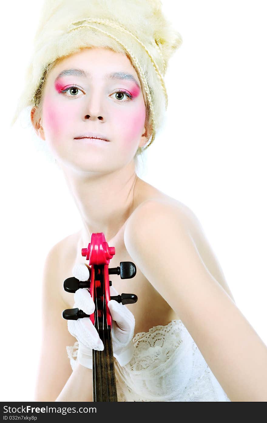 Portrait of an artistic young woman posing with violin. Isolated over white background. Portrait of an artistic young woman posing with violin. Isolated over white background.