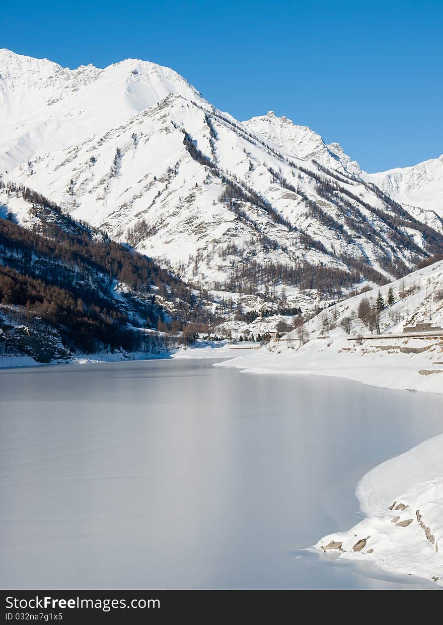 Frosty lake in the north of Italy during a sunny day.