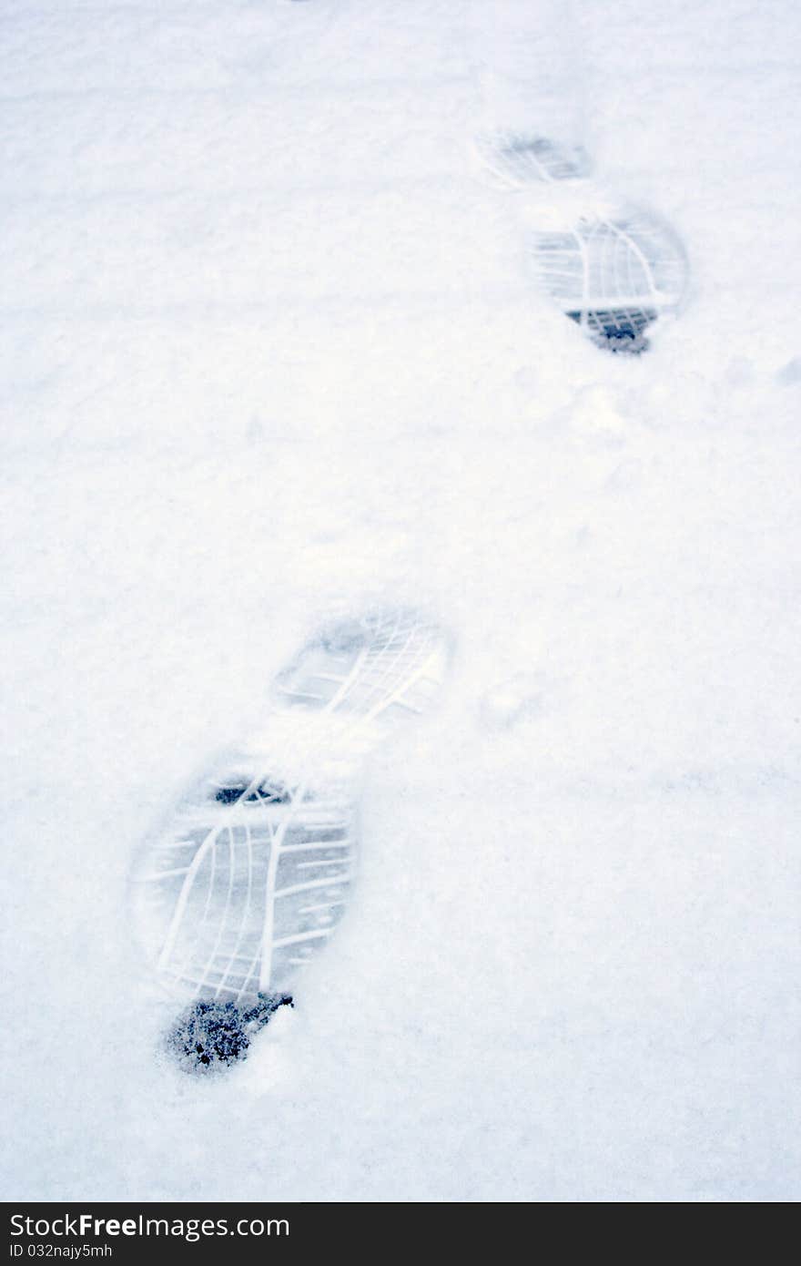 Footsteps in freshly fallen snow in early winter. Footsteps in freshly fallen snow in early winter