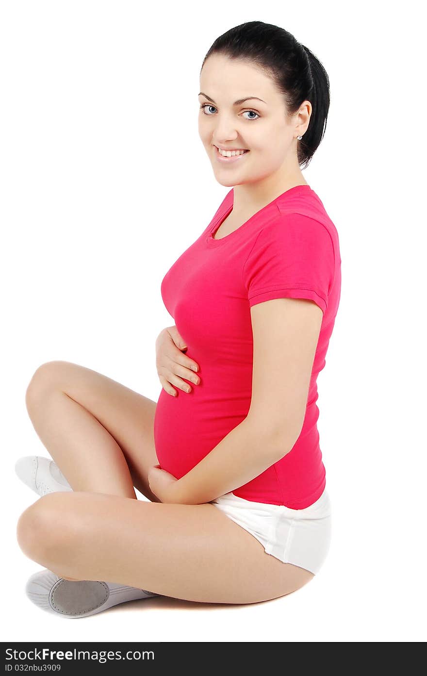 Young pregnant woman doing yoga isolated on white