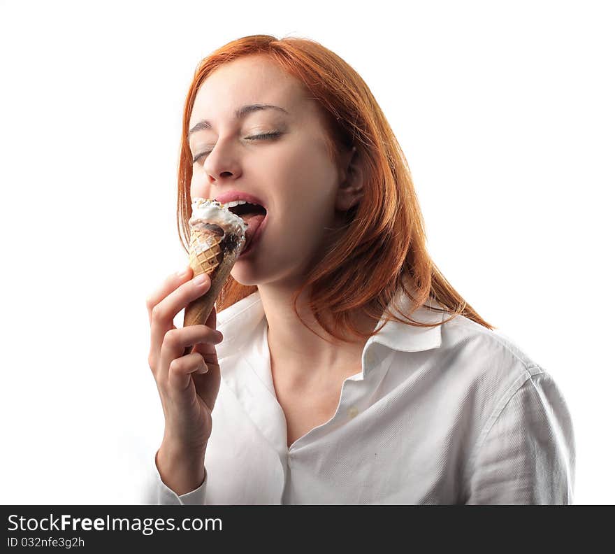 Young woman licking an ice cone