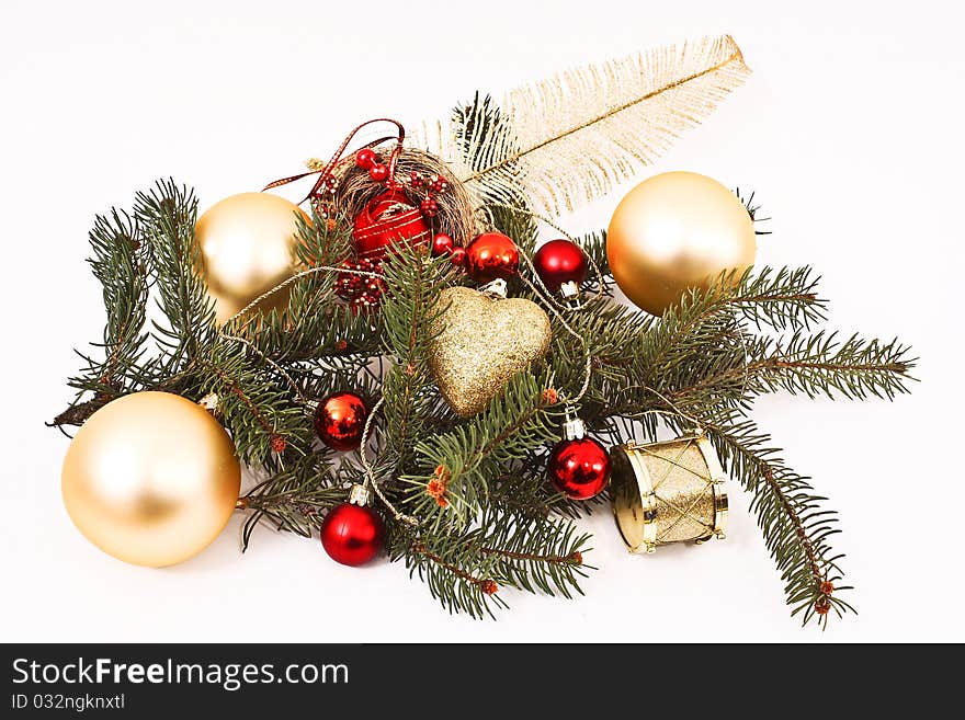 Gold Christmas baubles and Christmas tree branch