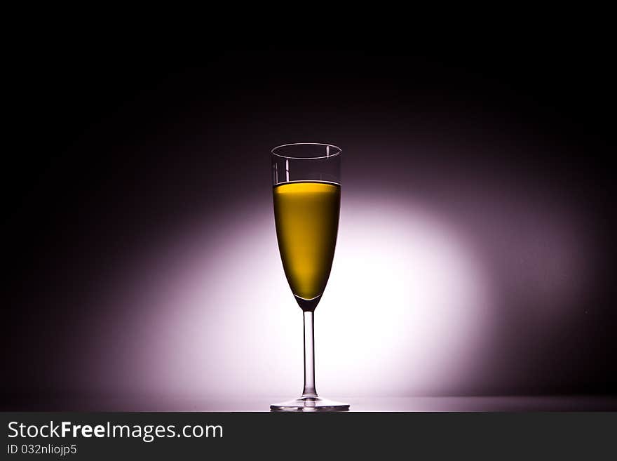 Glass of champagne with backlight