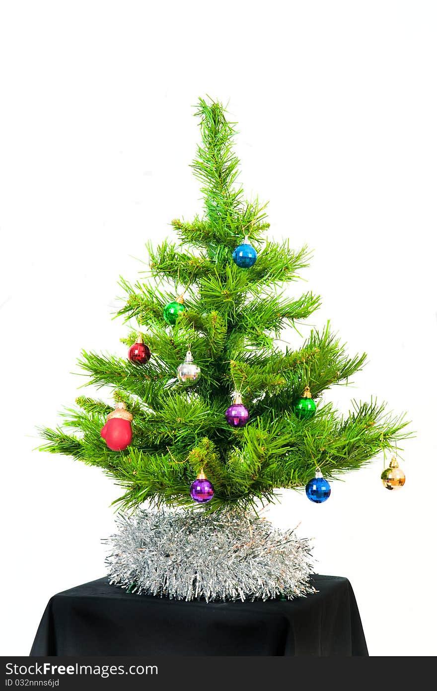 Image of Christmas fir tree decorated with color toy balls