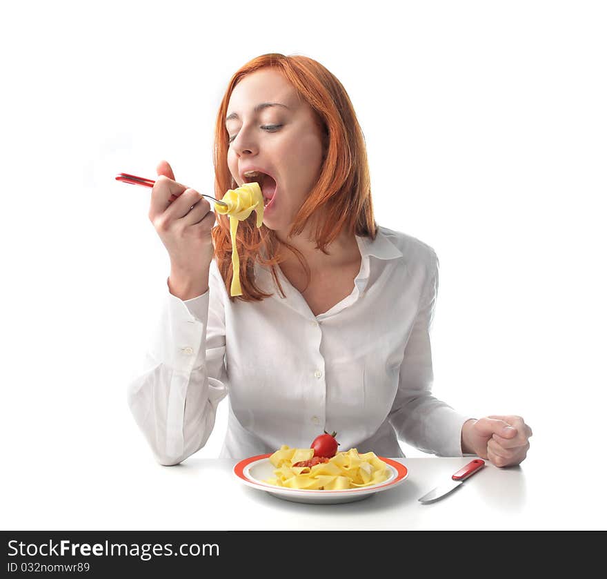 Young woman eating tagliatelle with tomato sauce. Young woman eating tagliatelle with tomato sauce