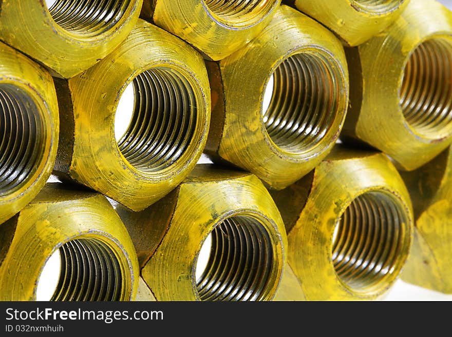 Lugnuts from a racecar wheel on a white background in a studio setting