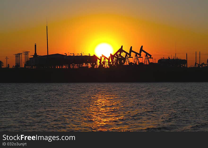 Oil pump against setting sun