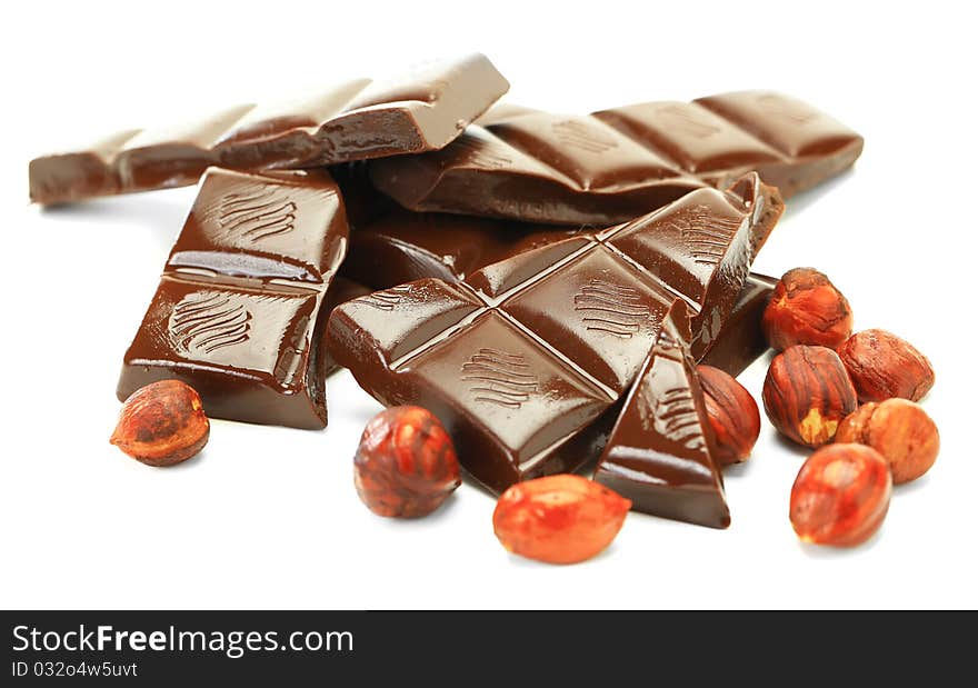 Hot chocolate with hazelnuts on a white background. Hot chocolate with hazelnuts on a white background