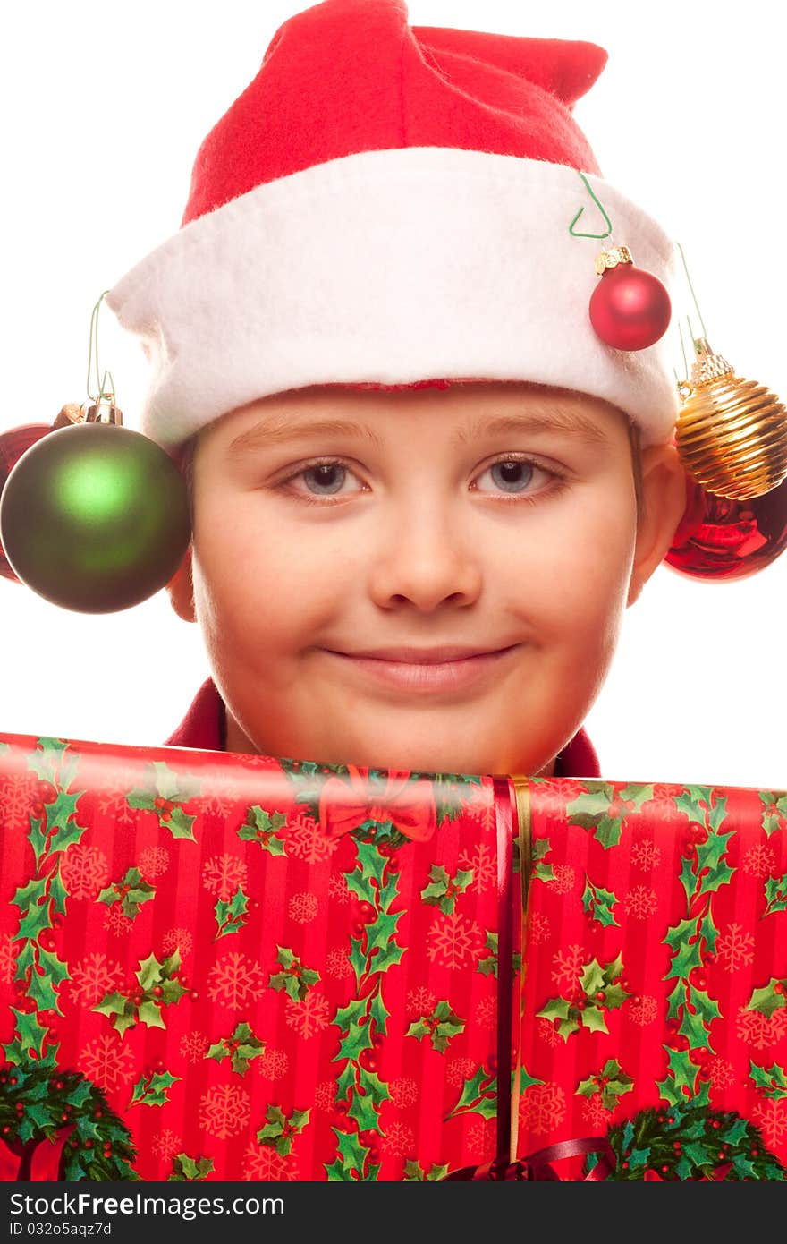 Christmas boy with a santa hat and ornaments. Christmas boy with a santa hat and ornaments