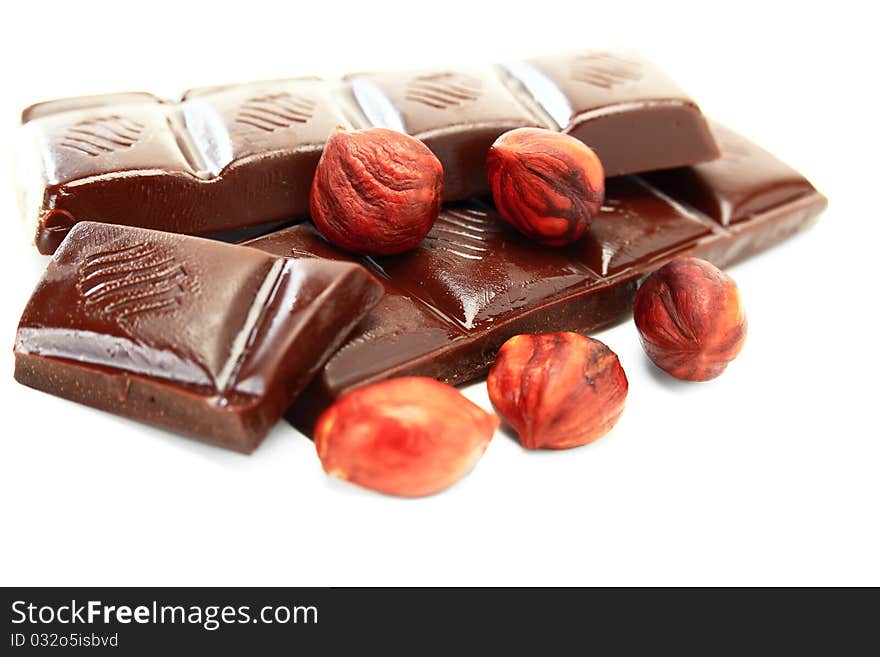 Hot chocolate with hazelnuts on a white background. Hot chocolate with hazelnuts on a white background