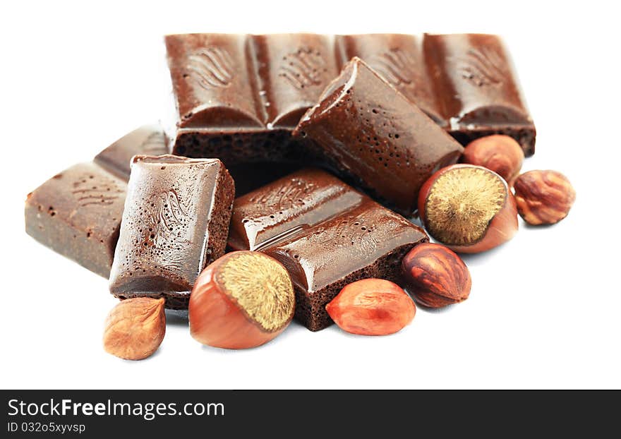 Hot chocolate with hazelnuts on a white background. Hot chocolate with hazelnuts on a white background