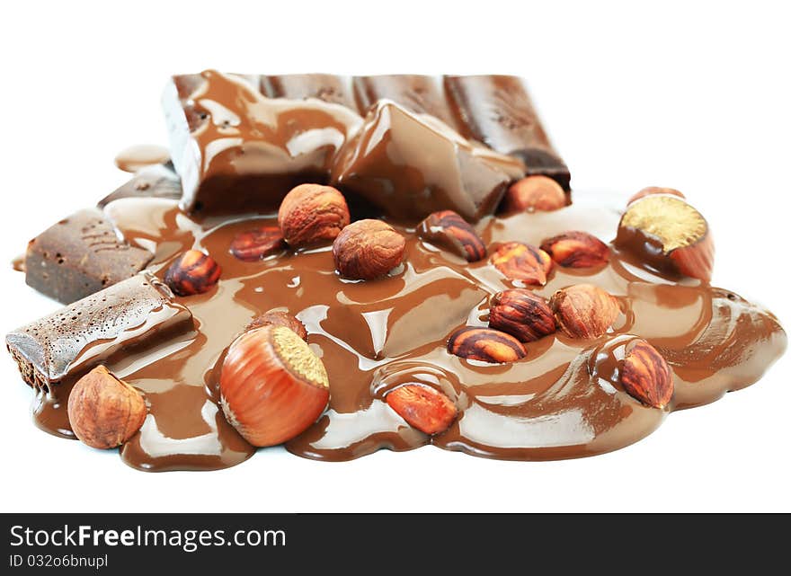 Hot chocolate with hazelnuts on a white background. Hot chocolate with hazelnuts on a white background