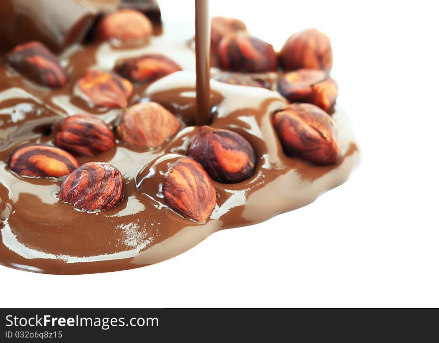 Hot chocolate with hazelnuts on a white background. Hot chocolate with hazelnuts on a white background