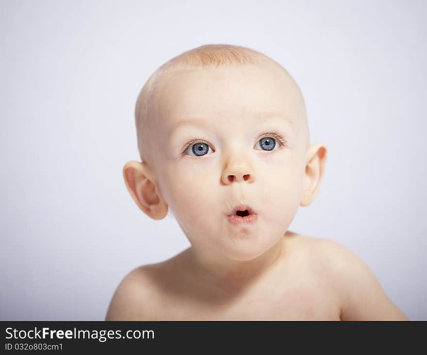 Little baby makes a puzzled expression, her first photo session. Little baby makes a puzzled expression, her first photo session