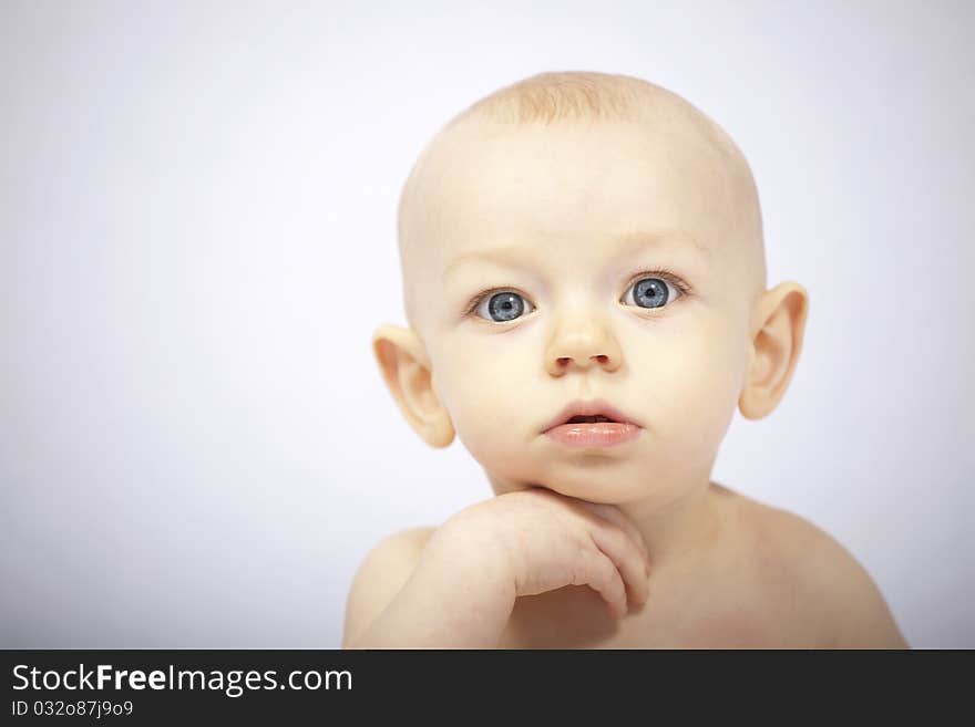 12 month old baby posing for the camera. 12 month old baby posing for the camera