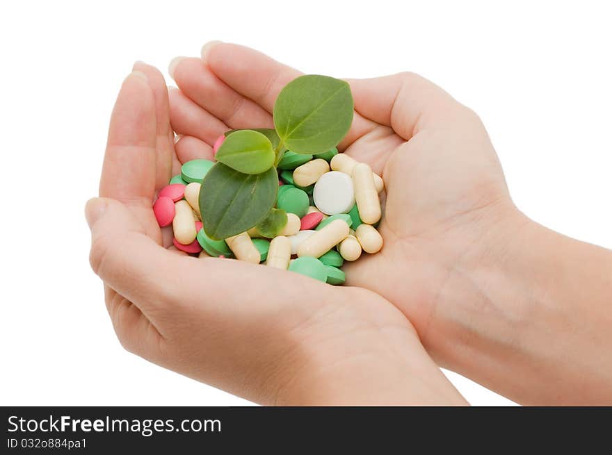 Hand with a pill on white background