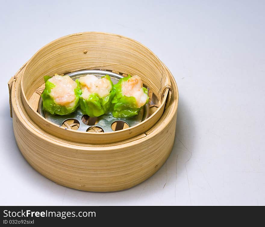 Chinese steamed dimsum in bamboo containers traditional cuisine. Chinese steamed dimsum in bamboo containers traditional cuisine