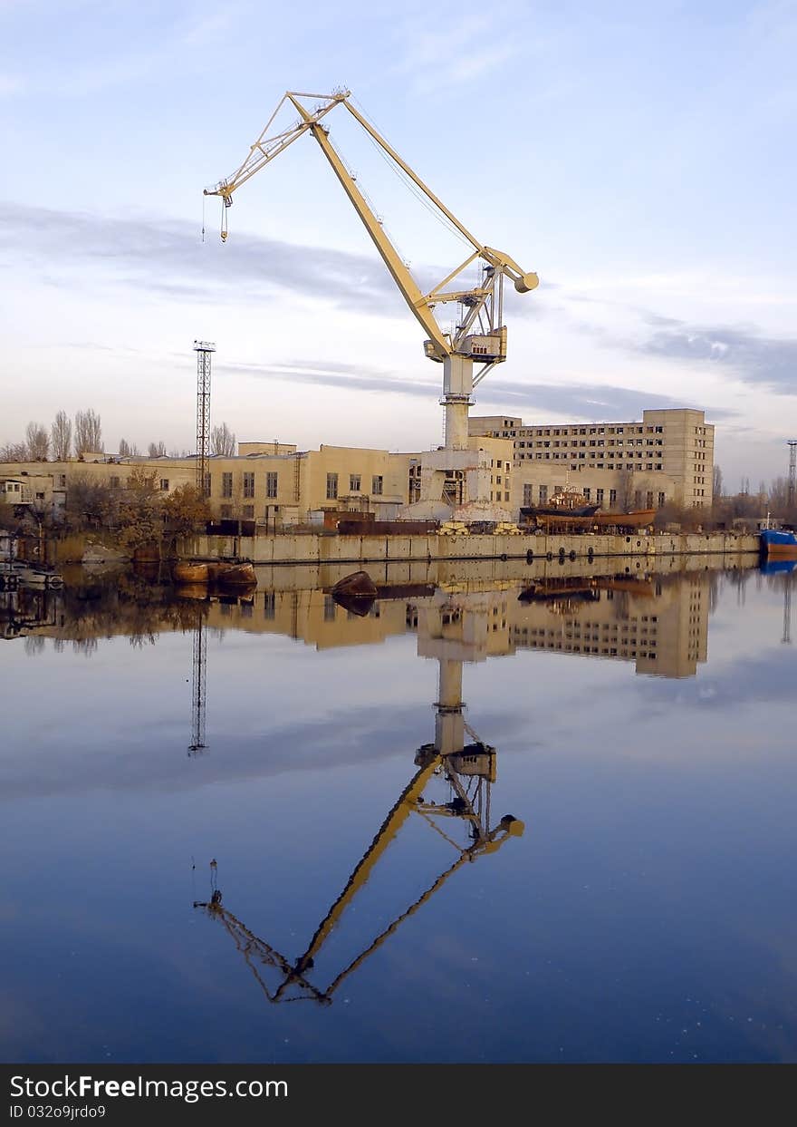 Reflection of the ship crane in water